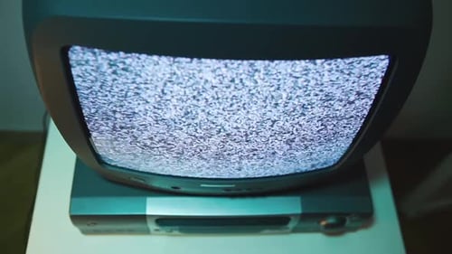 Closeup Top View of an Old TV Screen with Black and White Noise