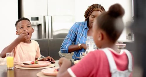 Happy Family Enjoying Breakfast Together at Home