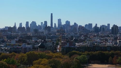 Panning Across a Park and Residential Buildings in Brooklyn Heights Reveals Midtown Manhattan