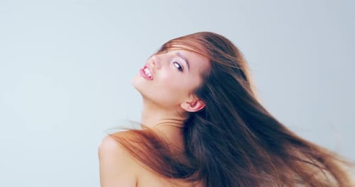 Beautiful Woman with Long Hair Posing in Studio