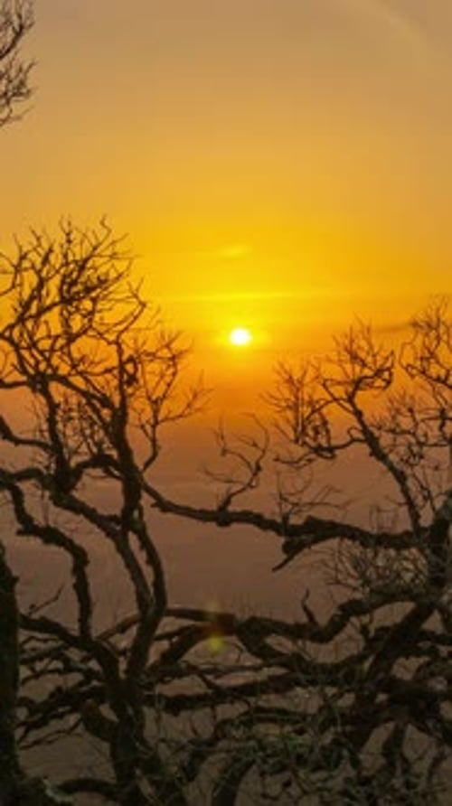 Sun Shining Through Clouds at Sunset