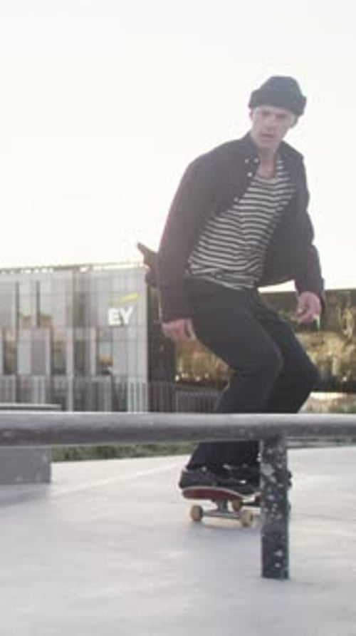 Man, city and action with skateboard for sports, trick and training to jump on rail for grind