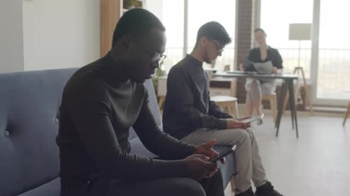 Two Men Using Gadgets