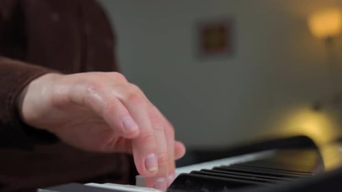 Close Up of Hands Playing Piano Keys