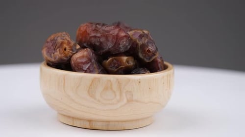 Bowl of Medjool Dates on White Tabletop