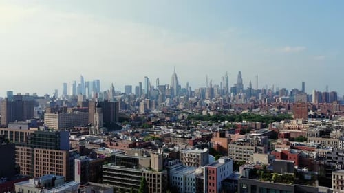 Aerial View of New York City's Manhattan Skyline Featuring Iconic Skyscrapers and a Lush Green Park