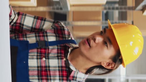Young Adults Collaborating on a Computer Monitor in Workshop