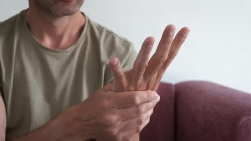 Male Experiencing Wrist Pain Indoor