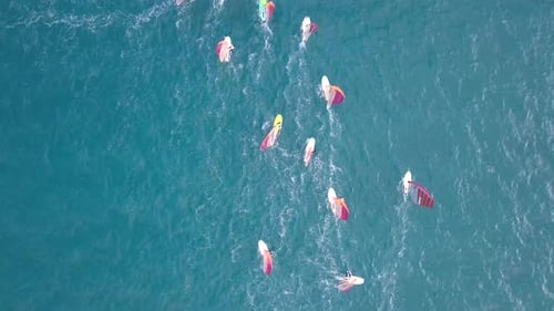 Aerial footage of High speed wind surfers riding the mediterranean waves