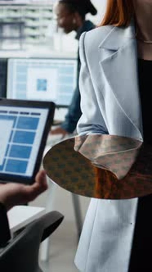Vertical Video Multiethnic Engineering Team Examines Silicon Wafer Trialing Advanced Materials