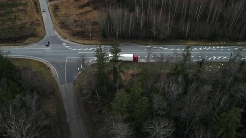 An Aerial View Capturing a Busy Intersection Featuring a Truck on a Beautiful Scenic Highway