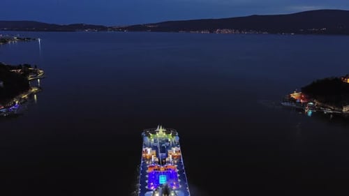 Illuminated Cruise Ship in Sea at Night