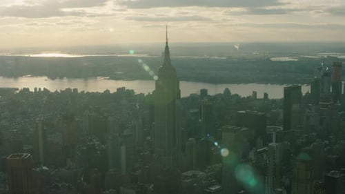 Golden hour aerial view of New York City skyscrapers including the empire state building
