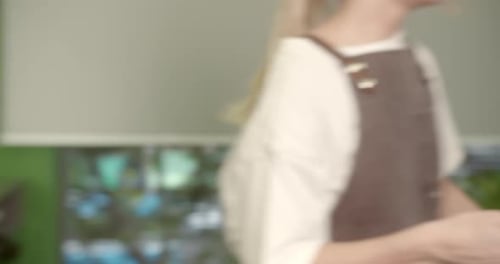 Man Receives Haircut in Professional Barbershop