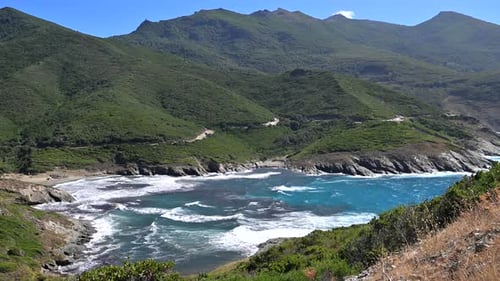Explore the Coastline at a Quiet Beach in Corsica on a Sunny Day