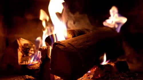 Burning Wood and Flames in a Fireplace
