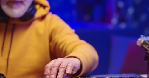 Close Up Shot of Caucasian Old Man DJ Hands Playing Music at Home Recording Studio Workshop Creating