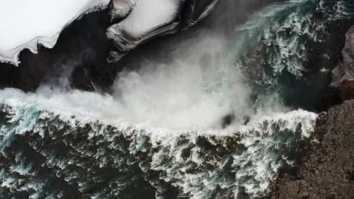 Aerial View of Powerful Waterfall in Winter