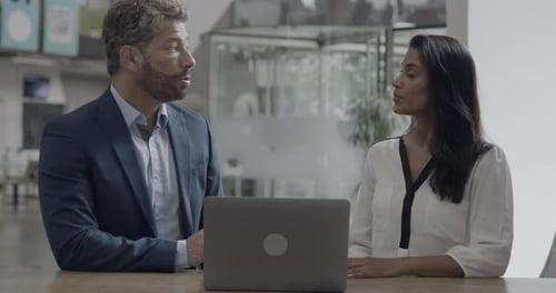 Business People Meeting and Talking in Office using Laptop