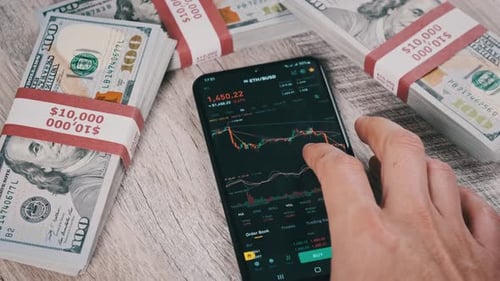 Investor Checking Cryptocurrency Ethereum Price on Smartphone Screen ETH