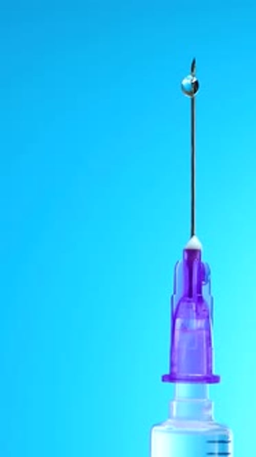 Transparent Liquid Forming Drop at Sharp End of Hypodermic Needle