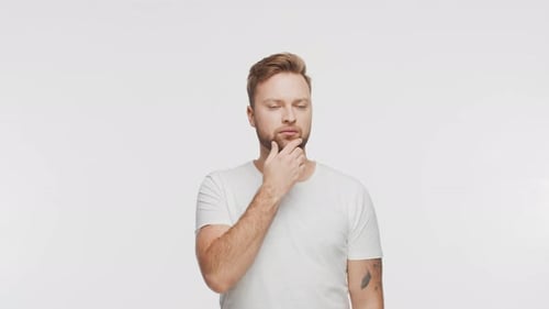 Thinking Young Man Over Vibrant Background Studio Portrait of Expressive Handsome Person