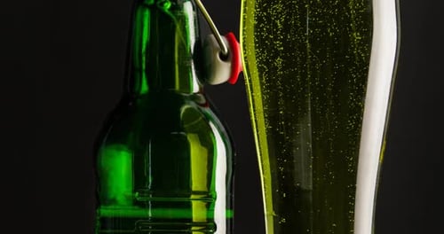Green Beer Bottle and Glass Close Up