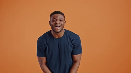 Smiling Young Man Waving Hello Portrait