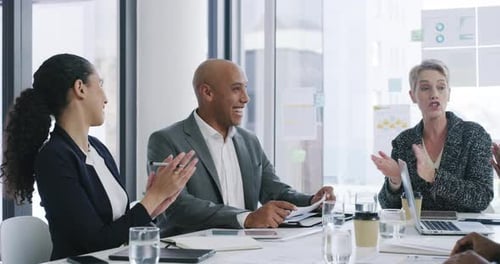 4k video footage of a group of businesspeople applauding a colleague during a meeting in an office