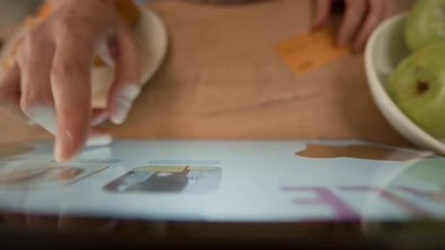 Woman Shopping Online with Tablet and Credit Card