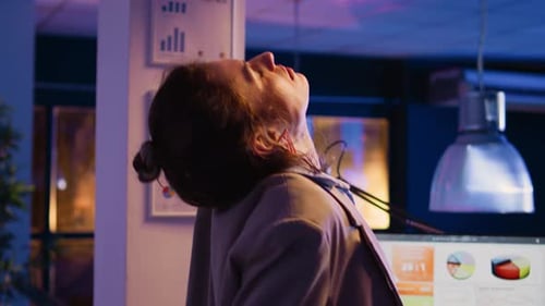 Company Worker Taking Break to Stretch Back in Office