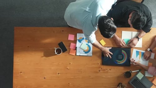 Top view of diverse business team talking and brainstorming idea. Convocation.