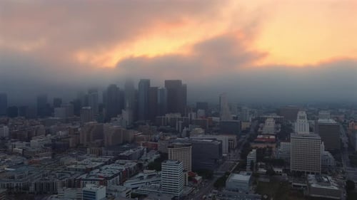 Panning aerial shot of sprawling Los Angeles skyline at golden hour