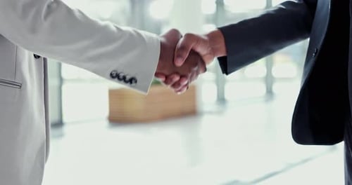 Business people, handshake and meeting in partnership, deal or agreement together at the office