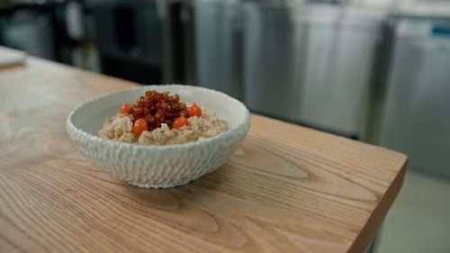 Grains Dish with Carrots on Wood Table