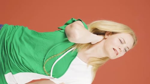 Woman Massaging Neck in Discomfort