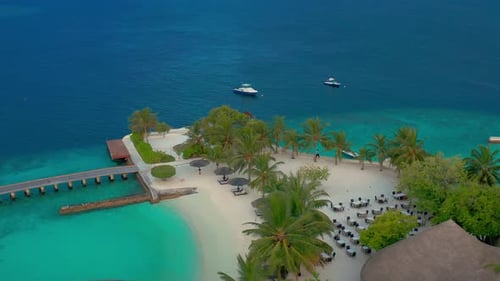 Aerial View on Beautiful Beach with Cafes on Paradise Island