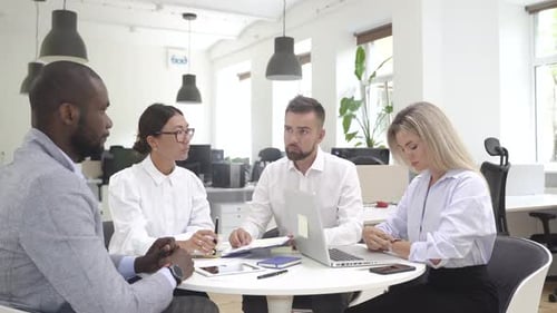 Multiethnic Business People During Meeting in Modern Office