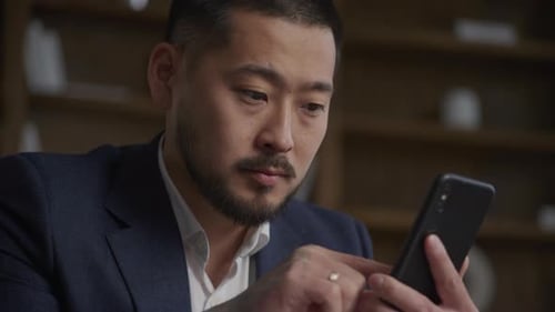 Businessman Using Smartphone Asian Guy Browsing Online