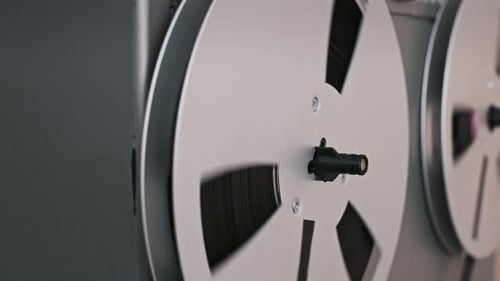 Rotating Reel-to-Reel Tape Recorder in Close Up