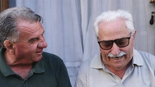 smiling old men smiling and talking: happiness, friendship, joy