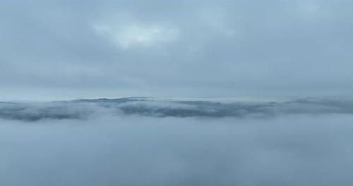 Misty Clouds Over Mountains Aerial Wide Shot