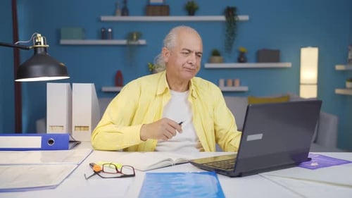 Home office worker old man is angry and furious
