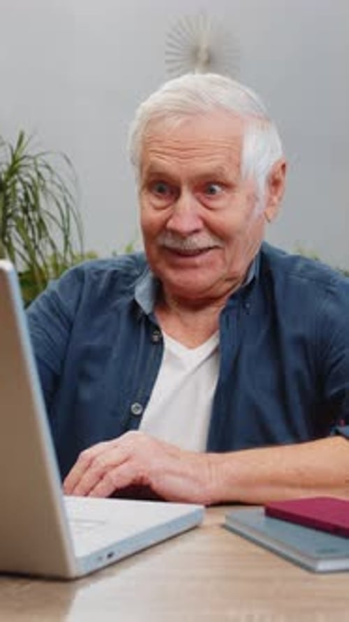Overjoyed Senior Man Working on Laptop Celebrate Success Win Money in Lottery Get Online Good News