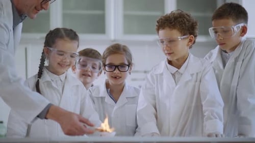 Children Observe Science Experiment in Bright School Lab