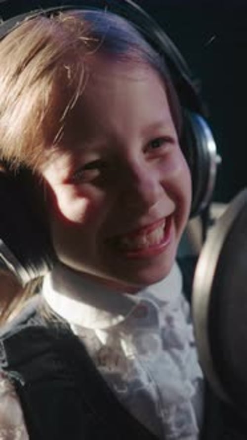 Giggling Child in Recording Studio Closeup