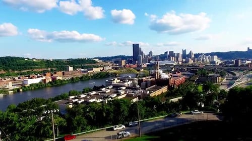 Drone rising shot next to the Allegheny River from Troy Hill. 16th street bridge, boat driving under