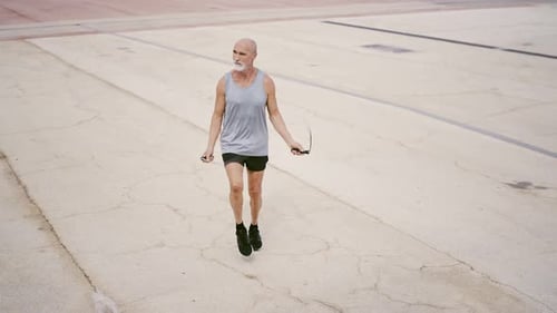 Senior Man Jumping Rope for Fitness Outdoors
