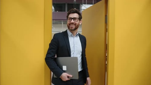 Closeup View of Caucasian Man in His 40s Working in Modern Office Space