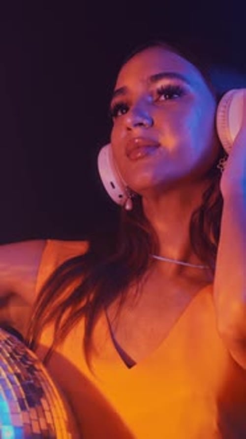 Female Zoomer Partying with Disco Ball in Neon Club